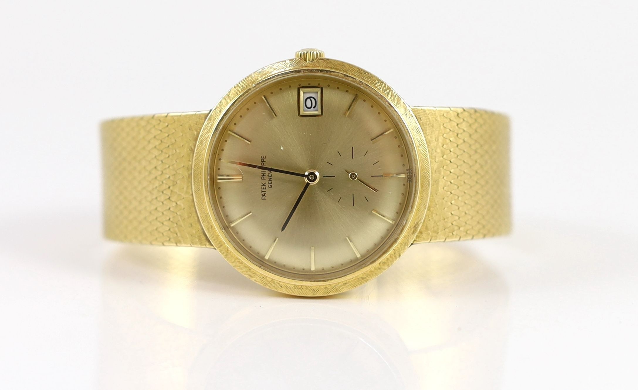 A gentleman's late 20th century 18ct gold Patek Philippe automatic dress wrist watch, on integral Patek Philippe 18ct gold bracelet